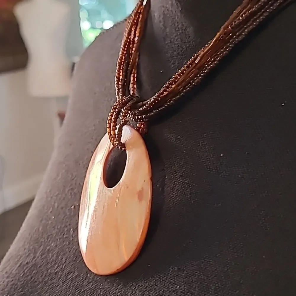 Abalone disc with stranded glass beads